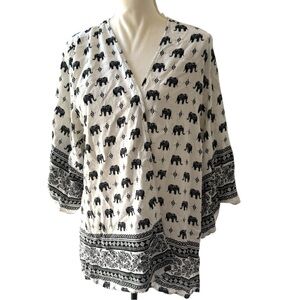 Stay Stylish with Our Charming Elephant Print Tunic! 🐘💫